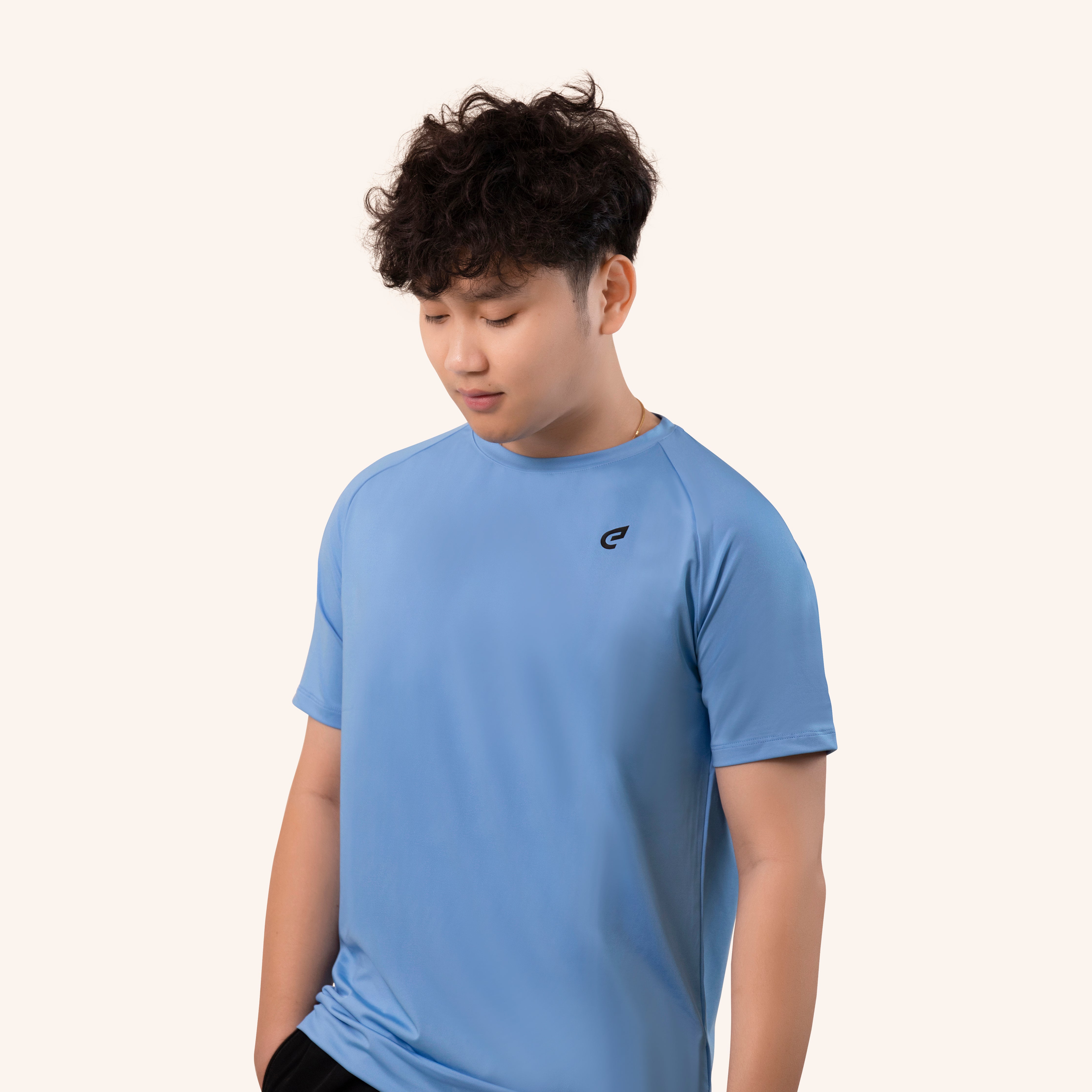 boy posing in blue tshirt